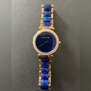 Michael Kors Gold Tone Watch with Blue Dial and Blue Faceted Links